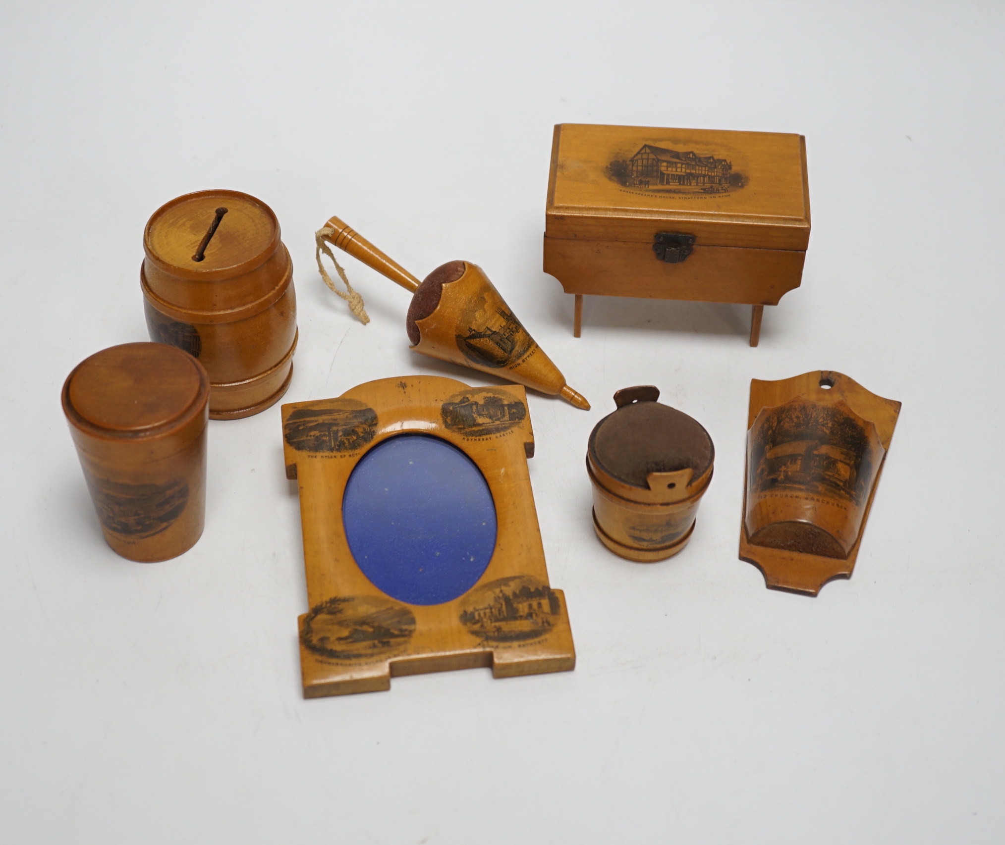 Sixteen mixed Mauchline ware boxes, pin cushions, pots, and a frame etc, tallest 13.5cm high